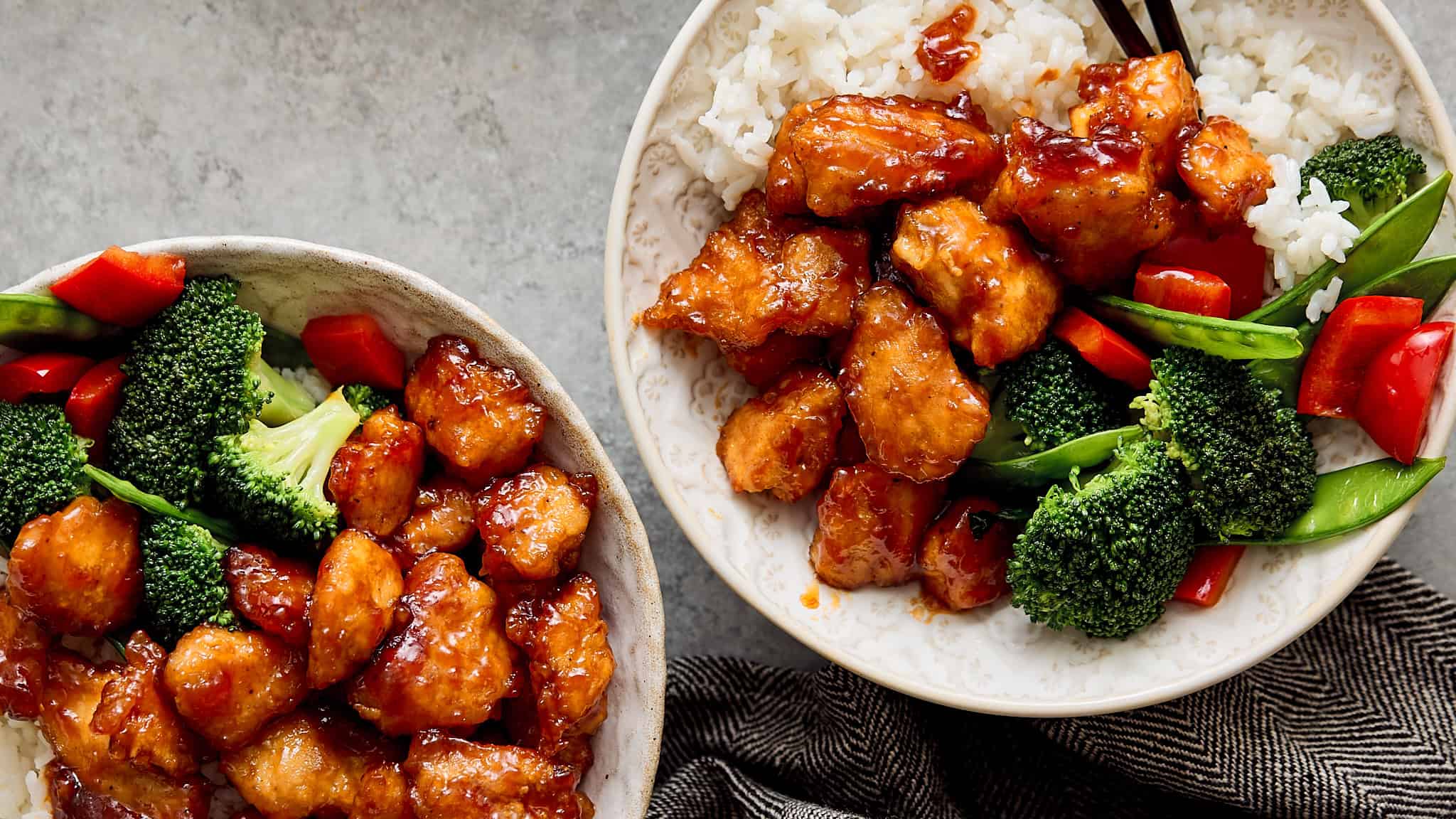 Sweet and savory chicken teriyaki bowls with fresh broccoli, red bell peppers, and steamed rice, perfect for a quick and healthy Asian-inspired meal.