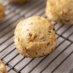 Crab meat and chives biscuits on cooling rack, fresh baked seafood biscuits, savory crab and chives biscuits for appetizers, crispy and golden seafood biscuits, homemade crab and chives seafood biscuits, relevance.