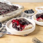 Cream Cheese Blueberry Pie with Fresh Blueberries and Blueberry Compote on a Wooden Table, homemade dessert recipe, easy berry dessert, no bake blueberry pie, summer fruit pie, blueberry cheesecake dessert.