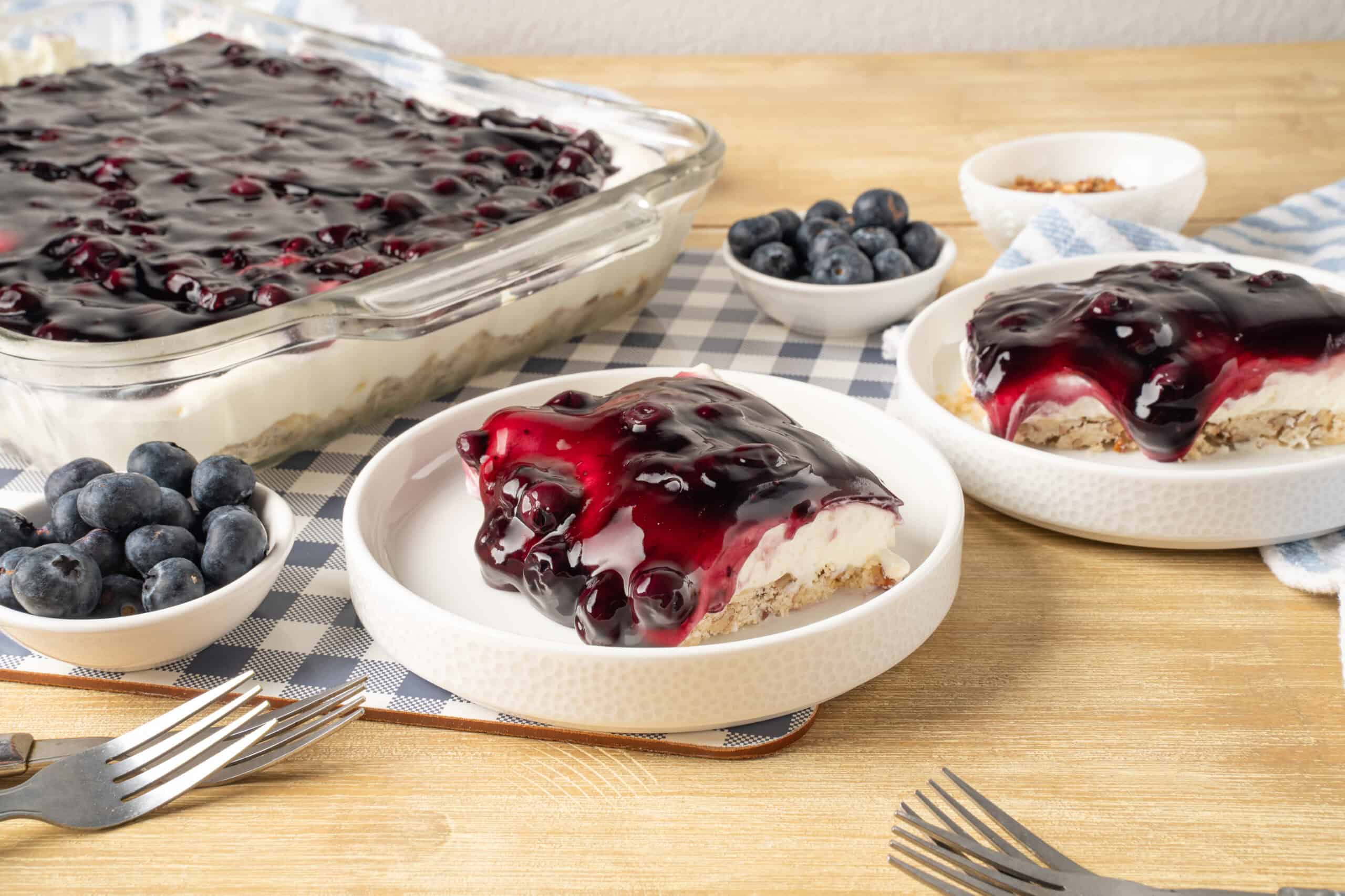 Cream Cheese Blueberry Pie with Fresh Blueberries and Blueberry Compote on a Wooden Table, homemade dessert recipe, easy berry dessert, no bake blueberry pie, summer fruit pie, blueberry cheesecake dessert.