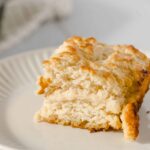 Buttermilk Biscuit with Butter and Honey - close-up of freshly baked fluffy buttermilk biscuit with golden crust, served on a white ceramic plate, perfect for breakfast or brunch, showcasing delicious comfort food.