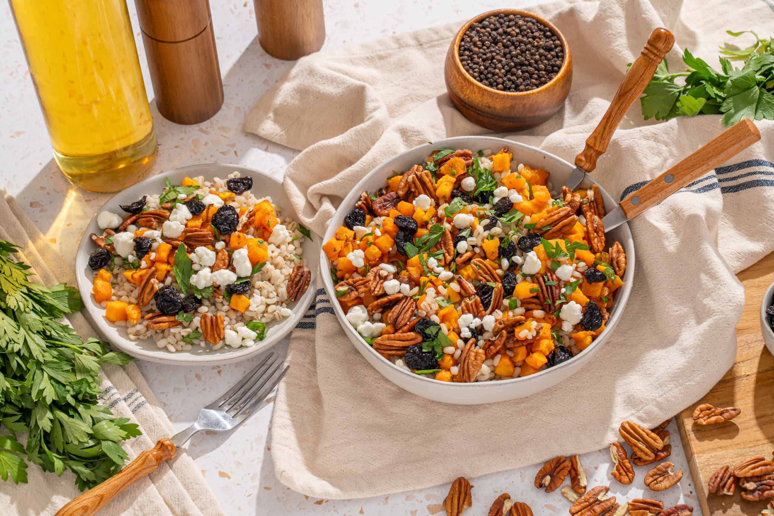 Golden beet and nut salad with dried fruits and fresh herbs in a rustic kitchen setting.
