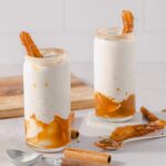 Creamy cinnamon sugar churro milkshakes with caramel drizzle and churro garnish, perfect for dessert or special occasions. Easy recipe idea from Hey Recipe for delicious treats.