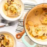 Juicy chicken thighs cooked in a creamy mushroom sauce with garlic, thyme, and potatoes, served with fresh herbs. Perfect comfort food recipe for dinner or special occasions.