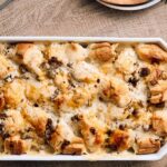Creamy chicken alfredo casserole with tender chicken, mushrooms, and melted cheese baked to golden perfection in a white serving dish. Perfect comfort food for family dinners or special occasions.