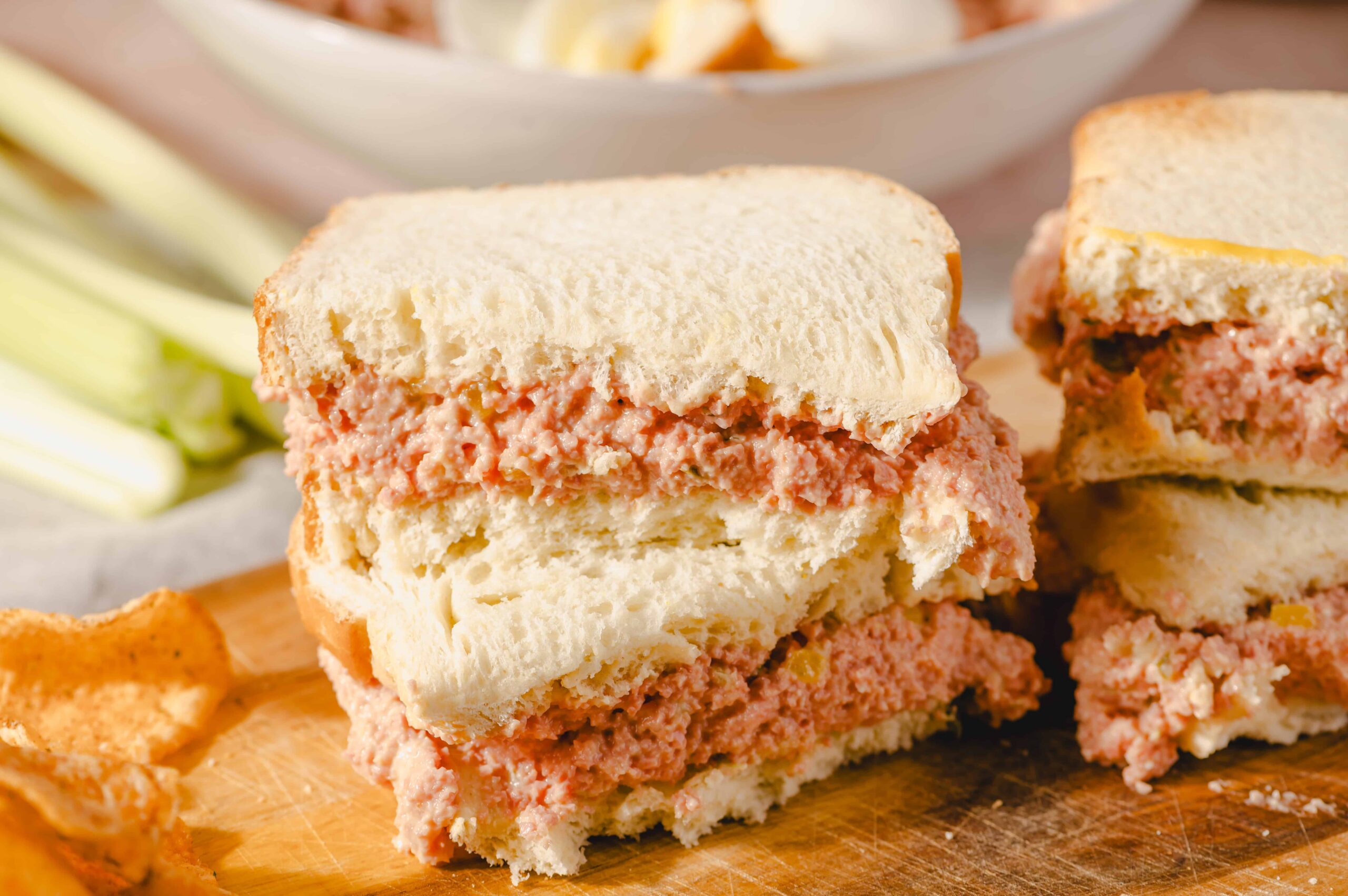 Buttered ham and cheese breakfast sandwich on white bread, close-up, for breakfast recipes and comfort food imagery.