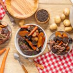 Slow-cooked beef stew with potatoes, carrots, and mushrooms in a comforting meal with fresh ingredients and a homey presentation. Perfect for cozy dinner recipes.