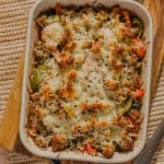 Creamy baked beef and vegetable casserole with melted cheese, perfect for a hearty family dinner. Deliciously loaded with seasoned ground beef, colorful peppers, and savory cheese topping.