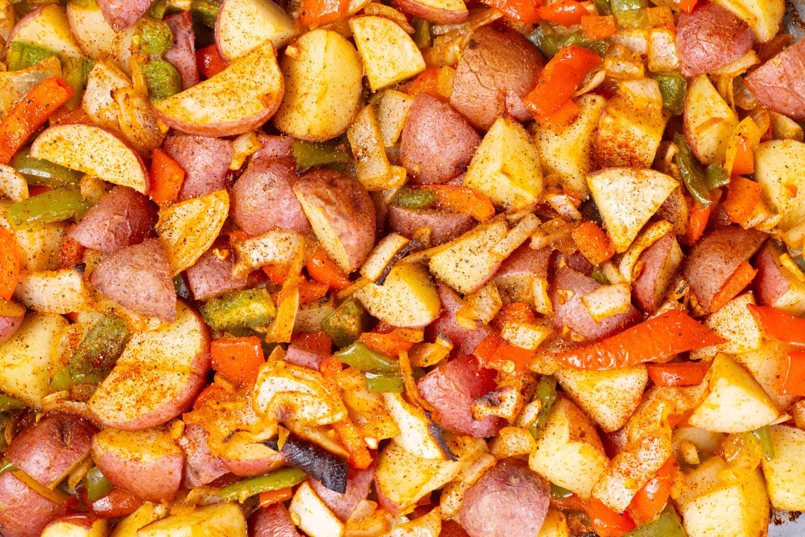 Sauteed hash browns with diced sausage, potatoes, carrots, and bell peppers seasoned with spices; perfect for breakfast or brunch.