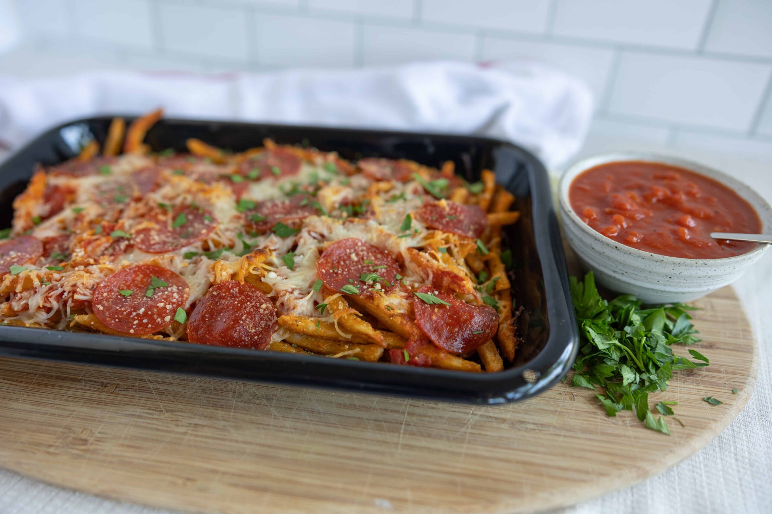 Delicious homemade baked ziti pasta with pepperoni, melted cheese, and fresh herbs served with marinara sauce on the side. Perfect for family dinner or casual gatherings.
