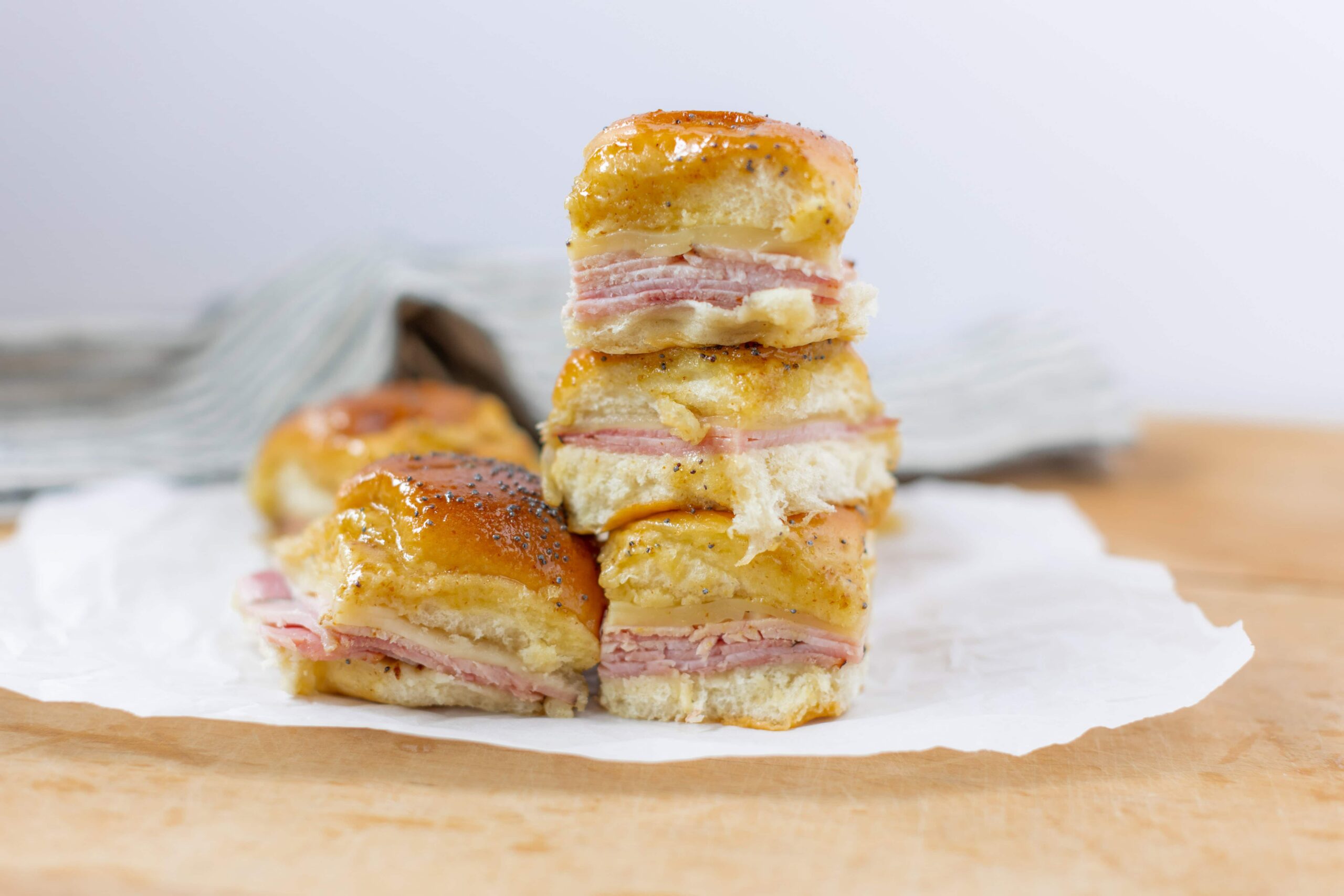 Savory ham and cheese breakfast casserole squares with a golden, crispy crust perfect for brunch or breakfast recipes.