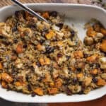 Creamy vegetable rice casserole with sweet potatoes, black beans, and chicken in a white baking dish. Healthy, flavorful, and easy-to-make comfort food perfect for family dinners.