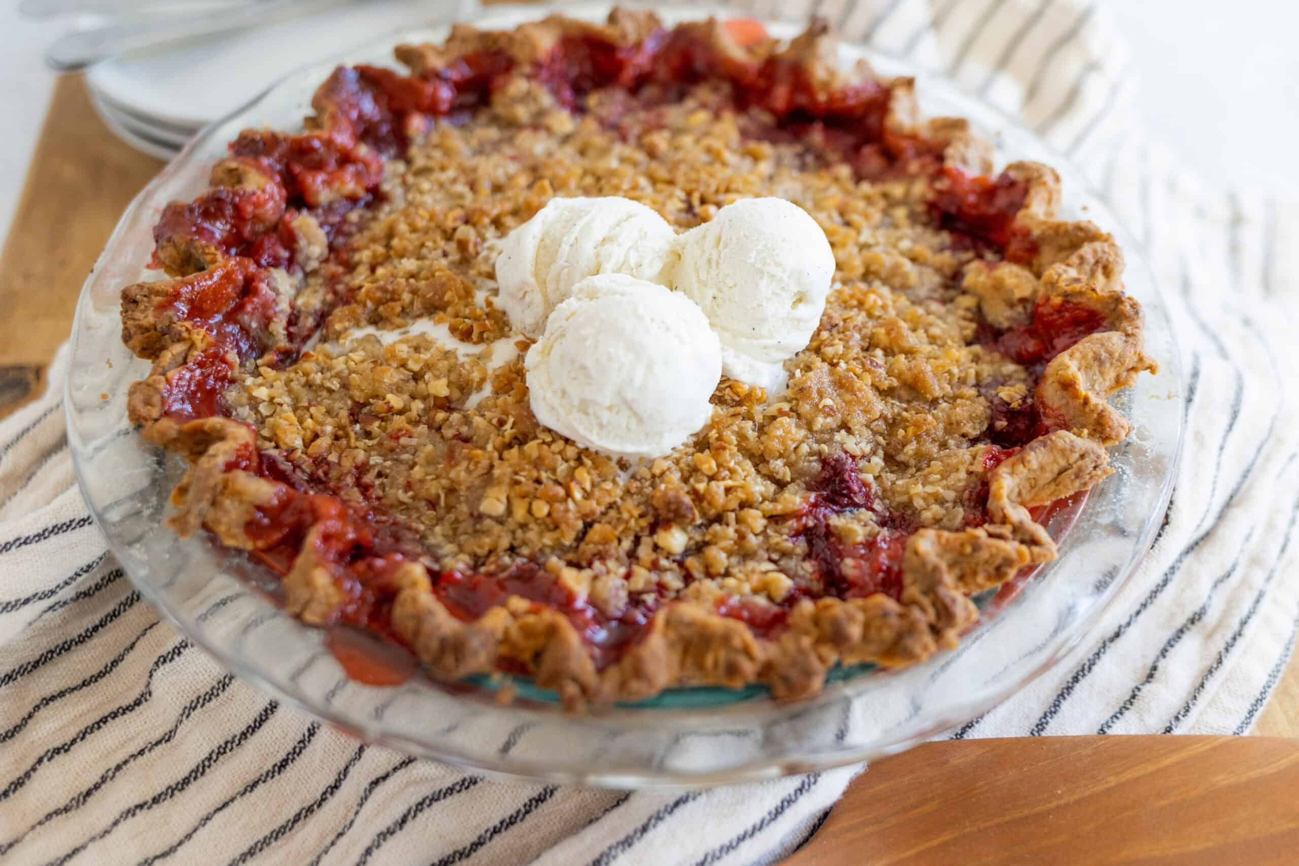 Buttermilk Cherry Pie with Ice Cream - Classic dessert with a flaky crust, sweet cherry filling, and crunchy topping, served with vanilla ice cream for a delightful treat. Perfect for summer gatherings.