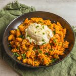 Creamy tomato basil pasta with rotini, topped with grated parmesan cheese and fresh chopped parsley - quick and easy comfort food recipe.