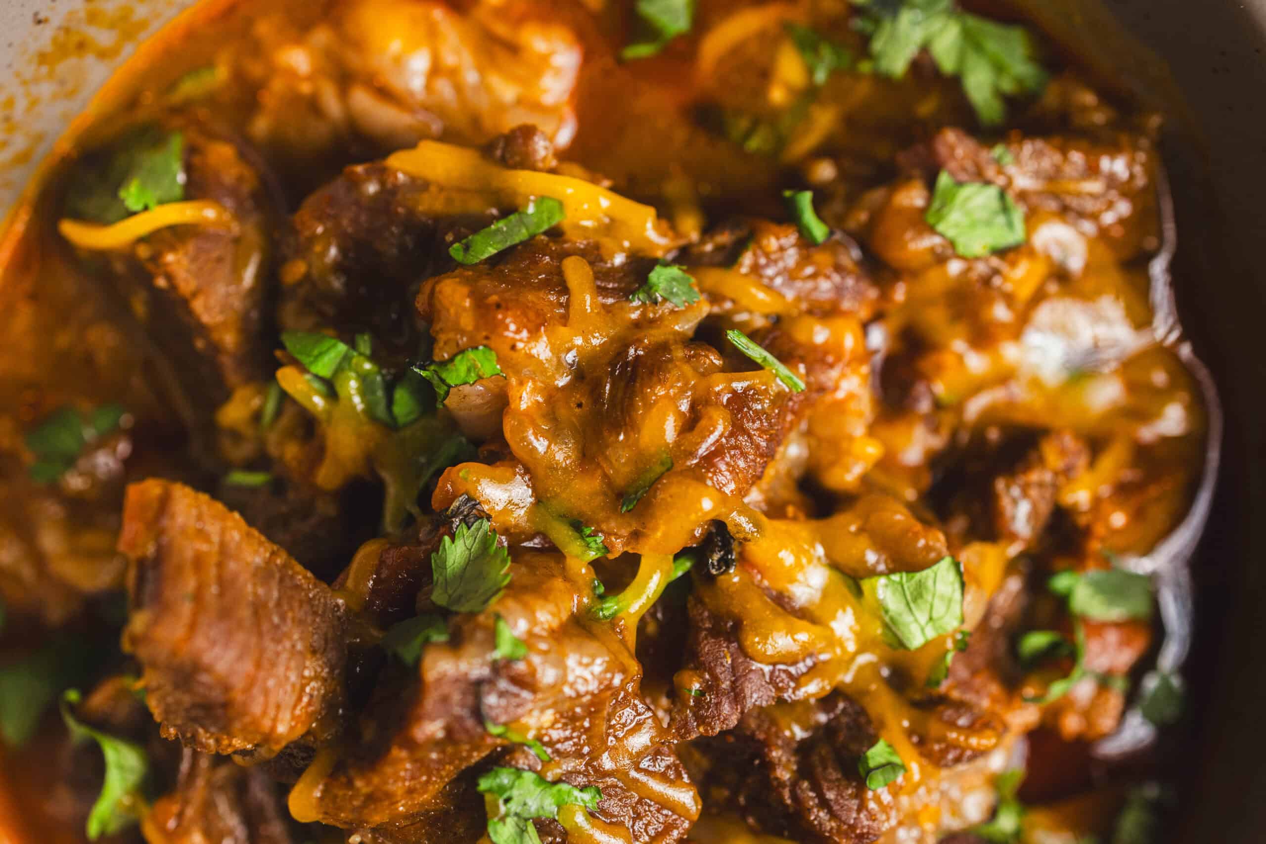 Slow cooker beef stew with tender beef chunks, carrots, potatoes, and herbs in rich, savory gravy, perfect for hearty comfort food meals.