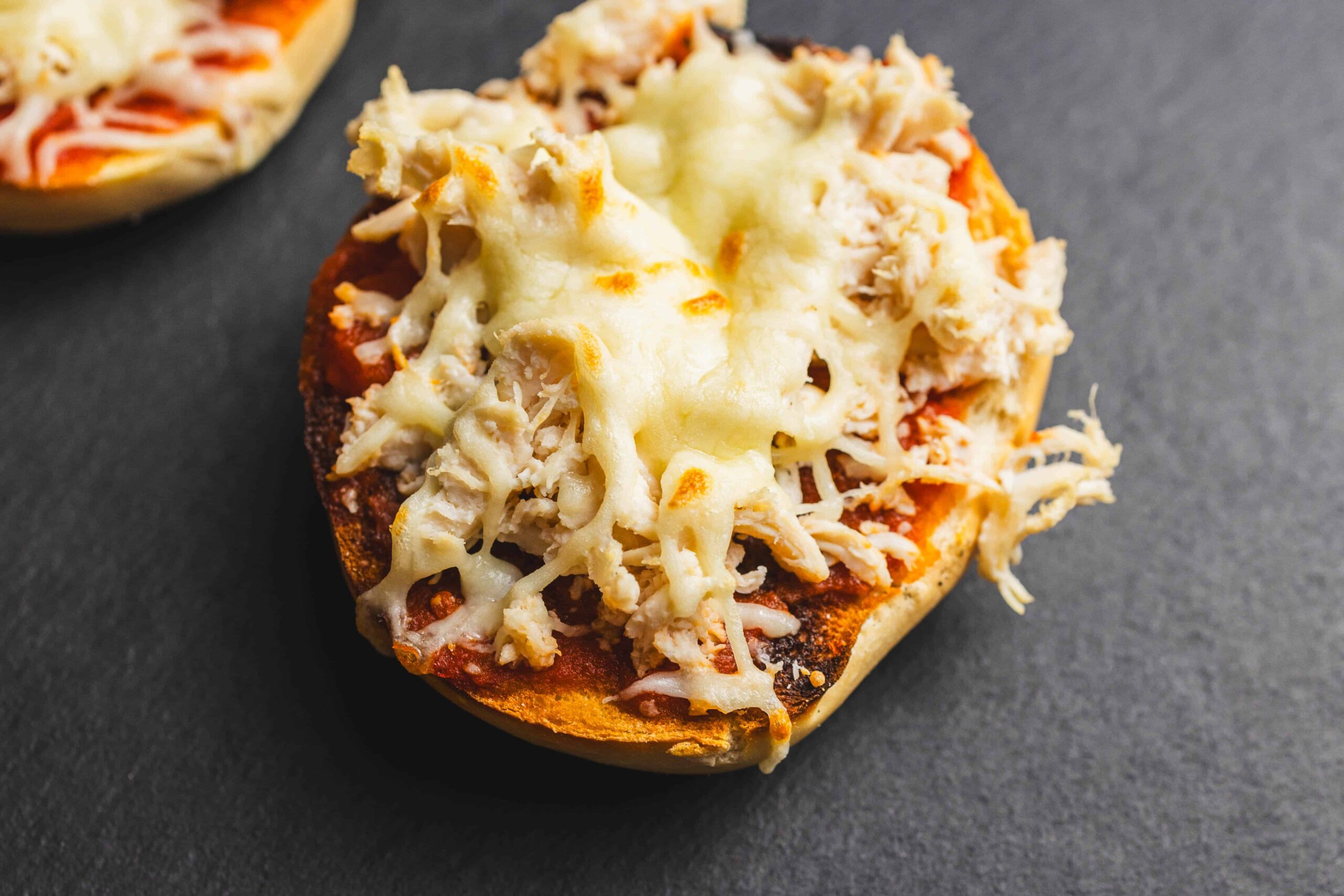 Cheddar cheese stuffed potato, cheesy baked potato with shredded cheese and chicken topping, delicious comfort food, easy potato recipe, cheese potato bake, savory baked potato with cheese and chicken.