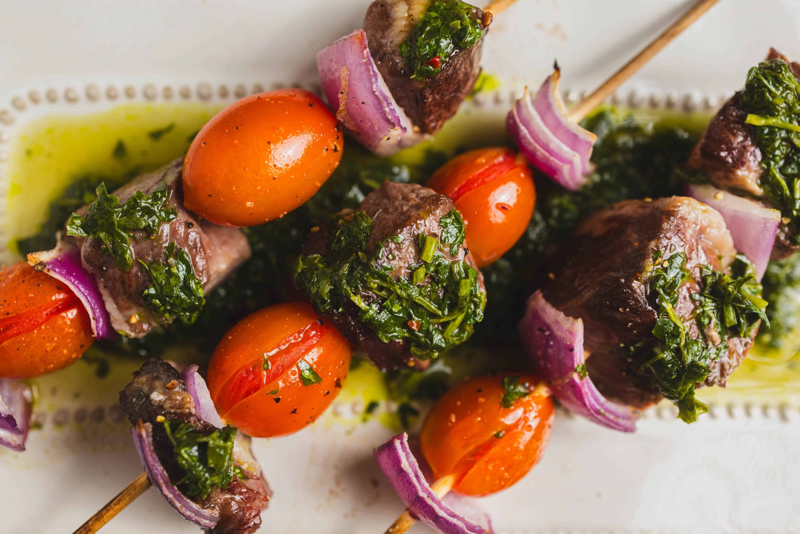 Juicy beef and vegetable skewers with cherry tomatoes, red onions, and fresh herbs, grilled to perfection. Ideal for healthy BBQ recipes and outdoor cooking.